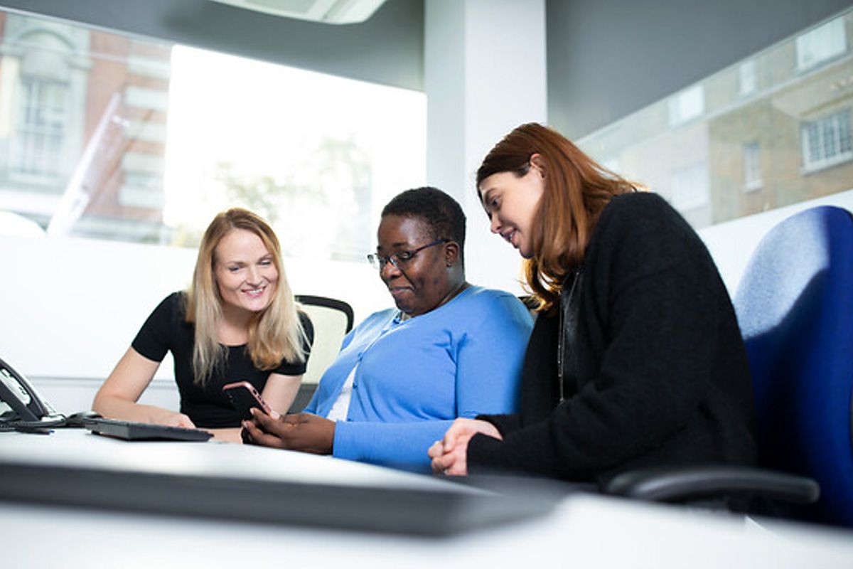 Students at UCL collaborating in a classroom.